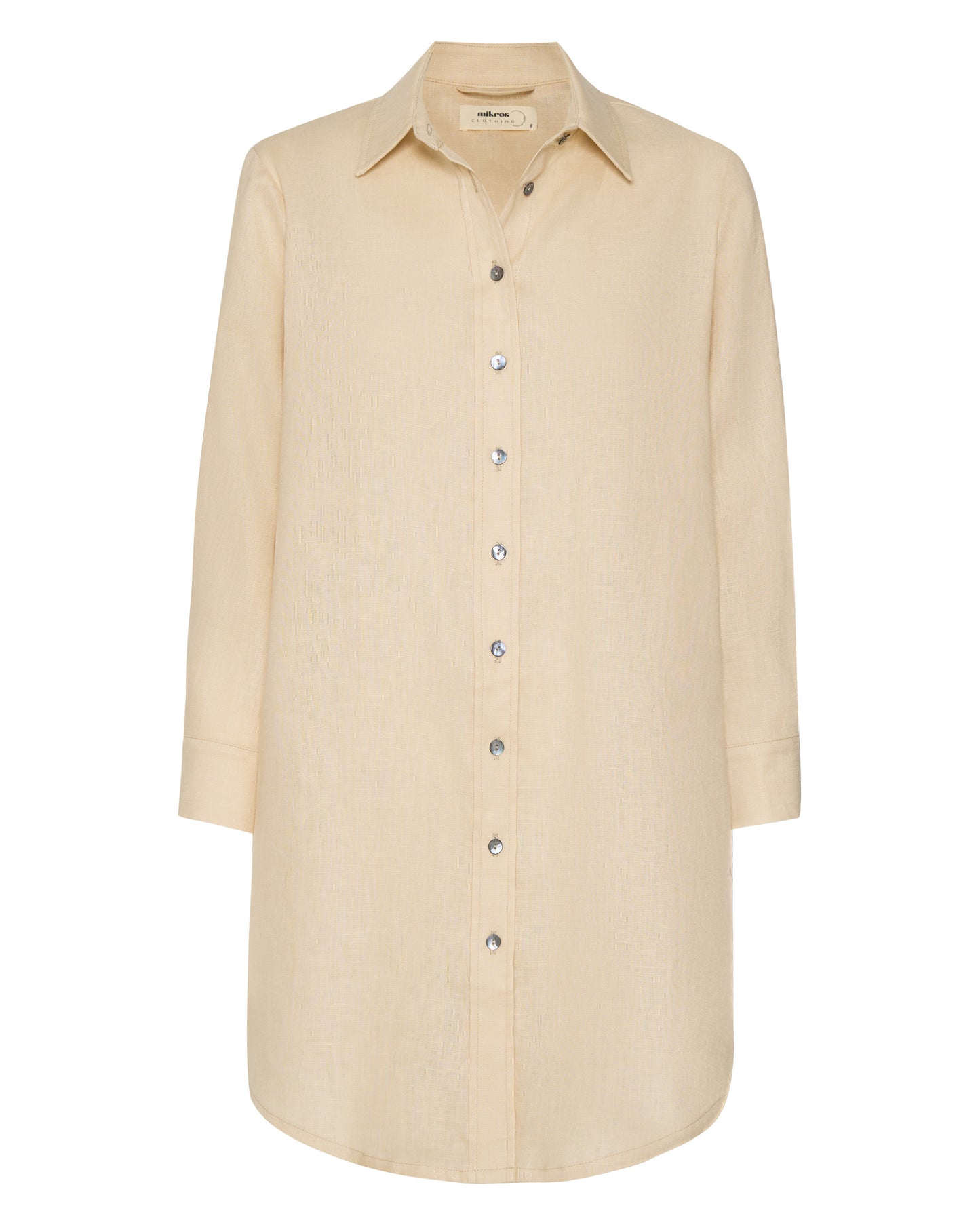 The front of a short sandy beige shirt dress without a waist tie.