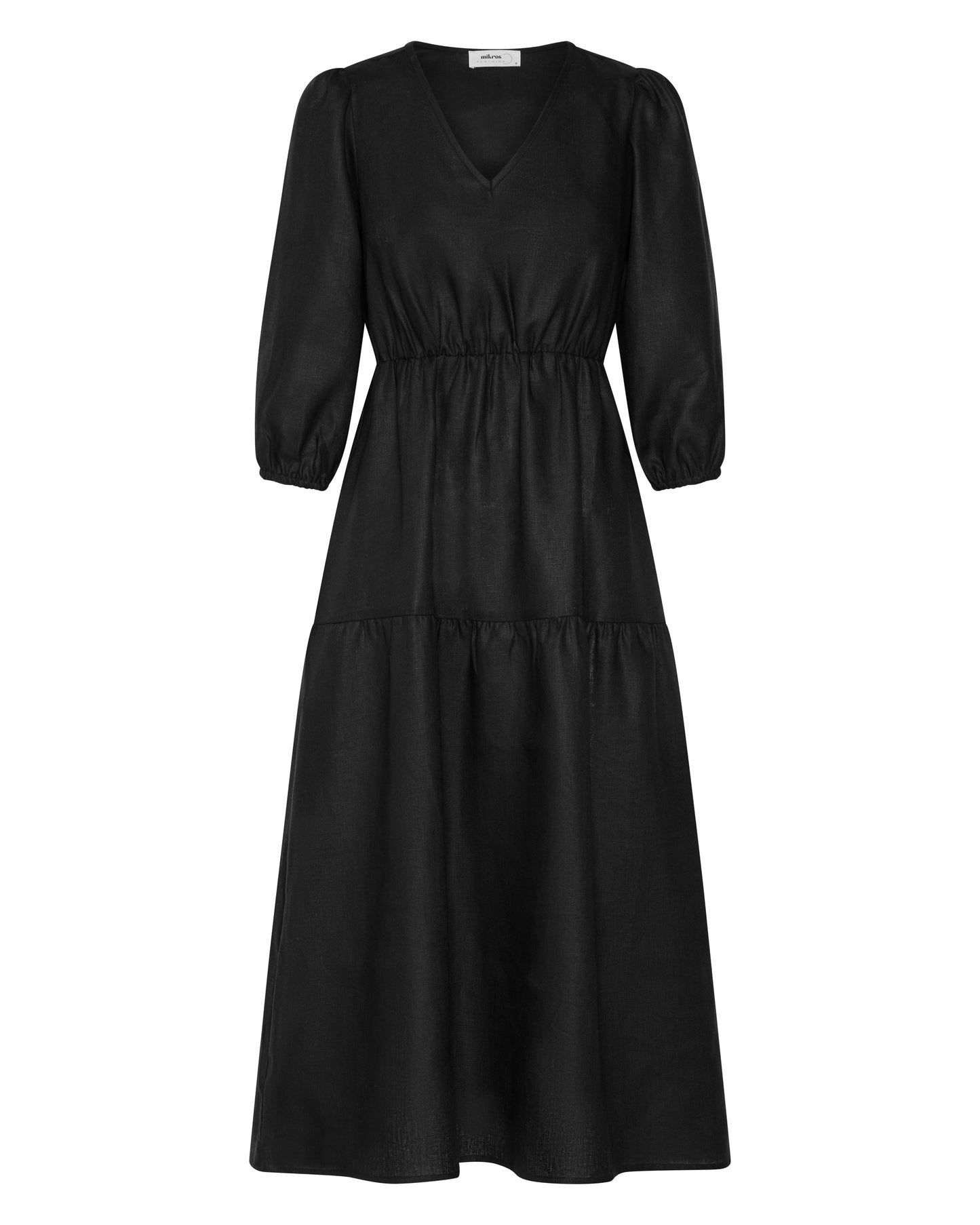 A long black linen dress, with a v neck and three quarter sleeves.